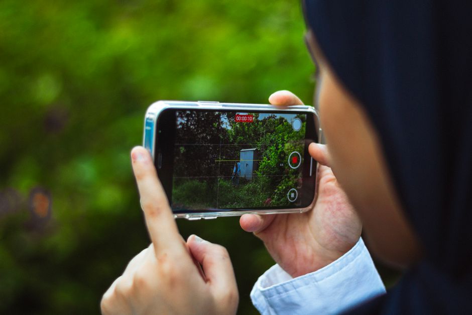 Person recording video on a smartphone