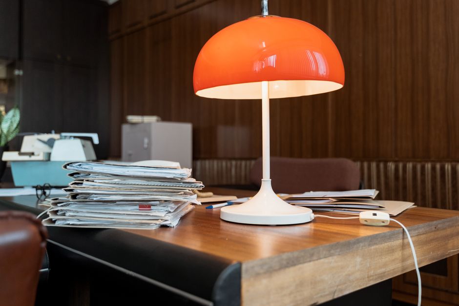 Stacks of paperwork on an office desk
