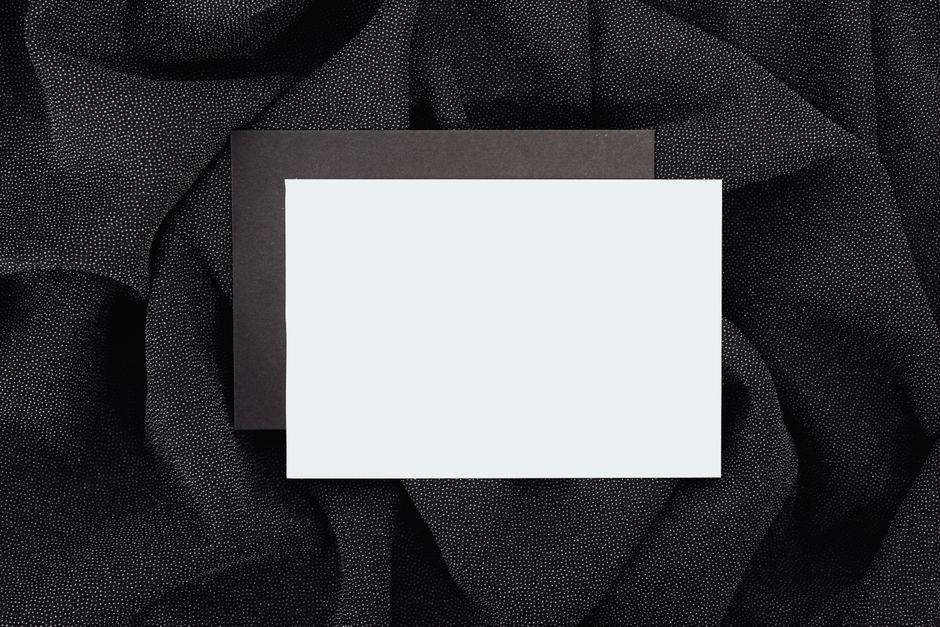 Blank white card on a dark surface