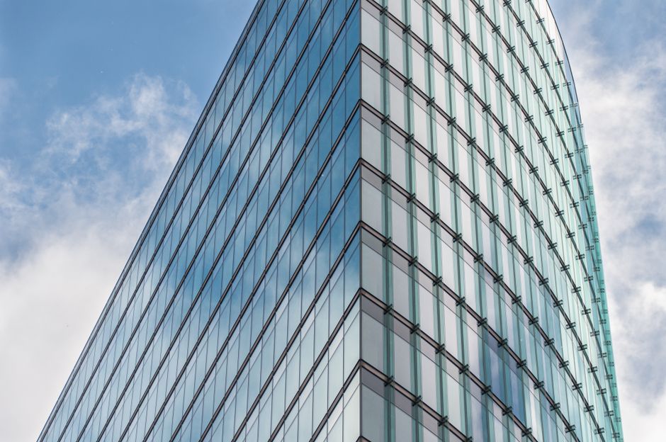 Glass office tower against the sky