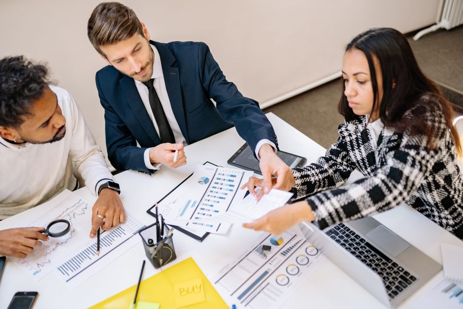 Team reviewing documents in a meeting