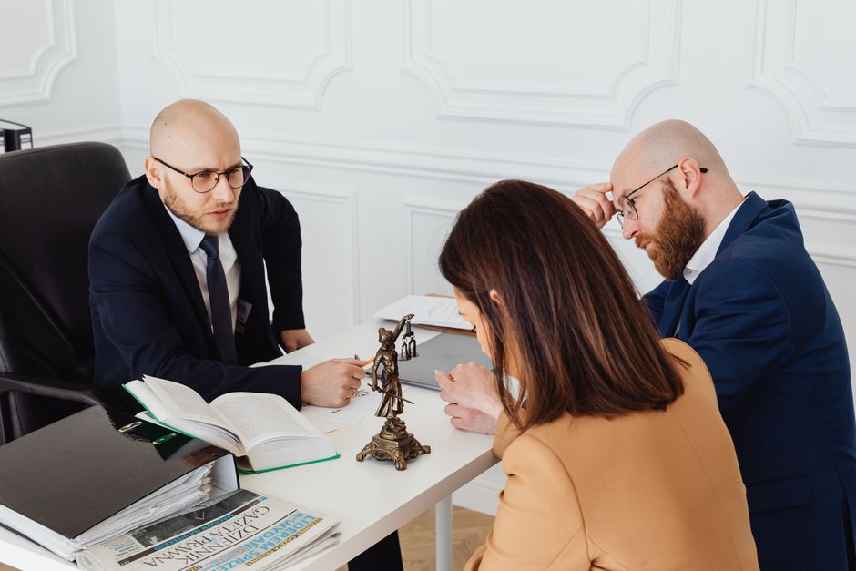 Attorney meeting with clients in an office